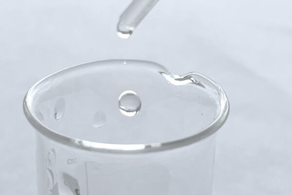 A drop of LactoComplex in a lab vial.